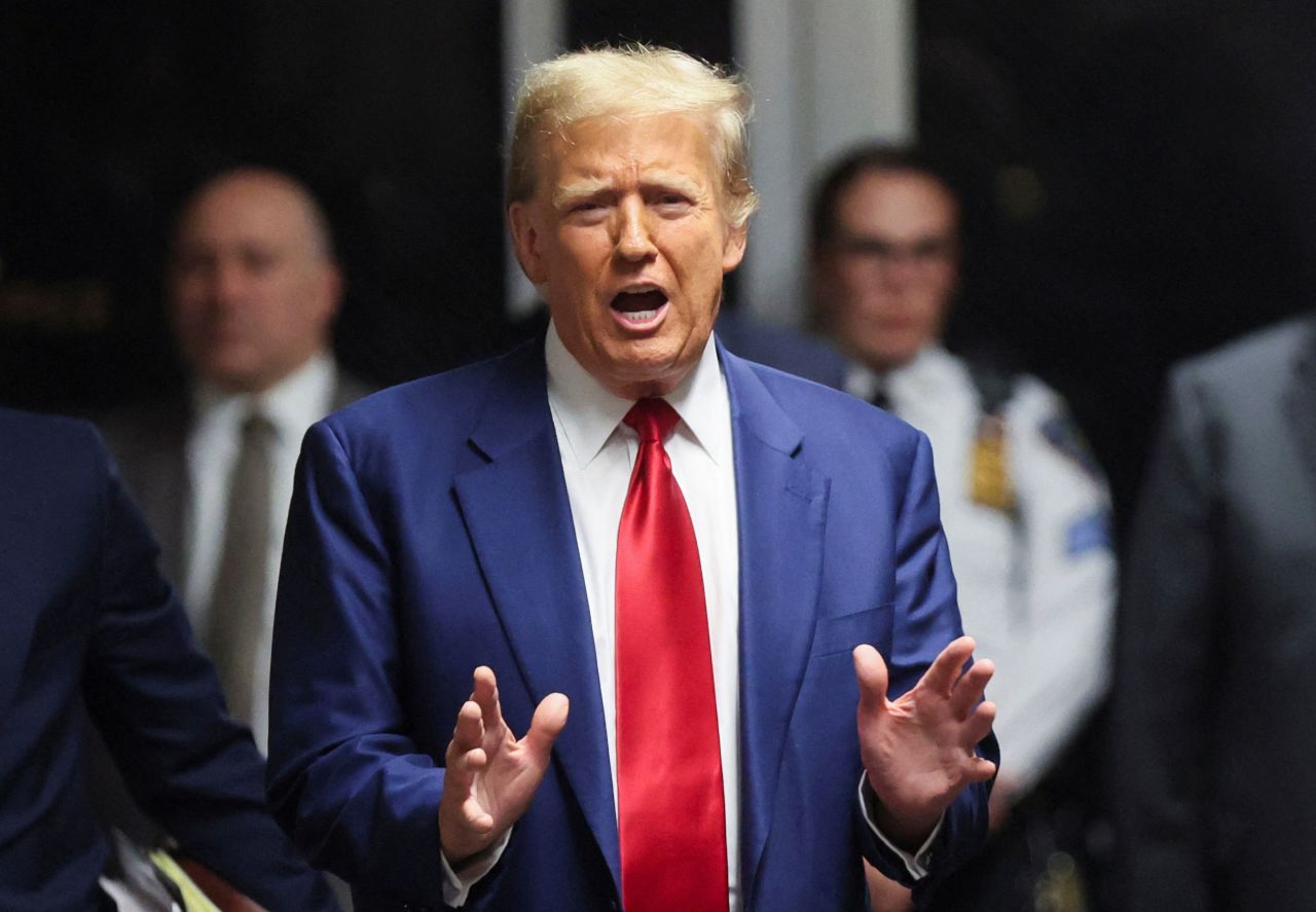 Former President Donald Trump speaks from the hallway outside a courtroom in New York on Monday.