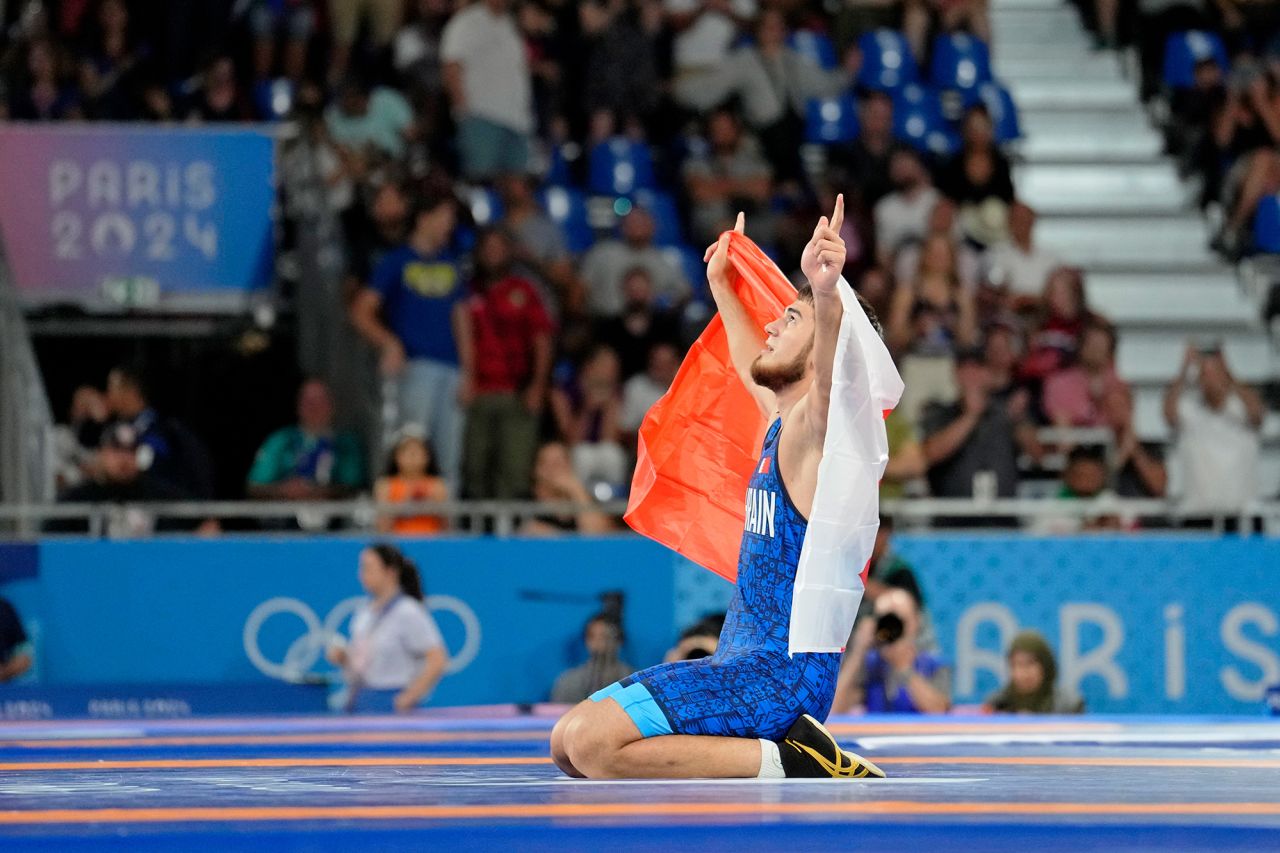 Bahrain’s Akhmed Tazhudinov celebrates winning gold in the men's 91kg freestyle wrestling final on August 11. 