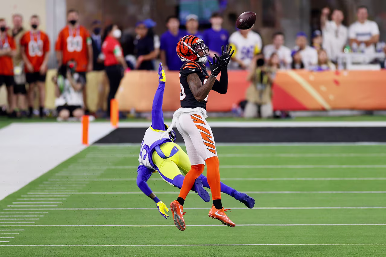 Tee Higgins of the Cincinnati Bengals catches the ball over Jalen Ramsey of the Los Angeles Rams for a touchdown in the third quarter.