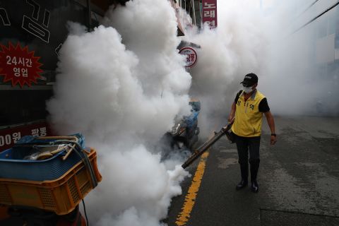 A worker disinfects an alley in in Seoul, South Korea, to prevent the spread of coronavirus on Saturday, August 29. 