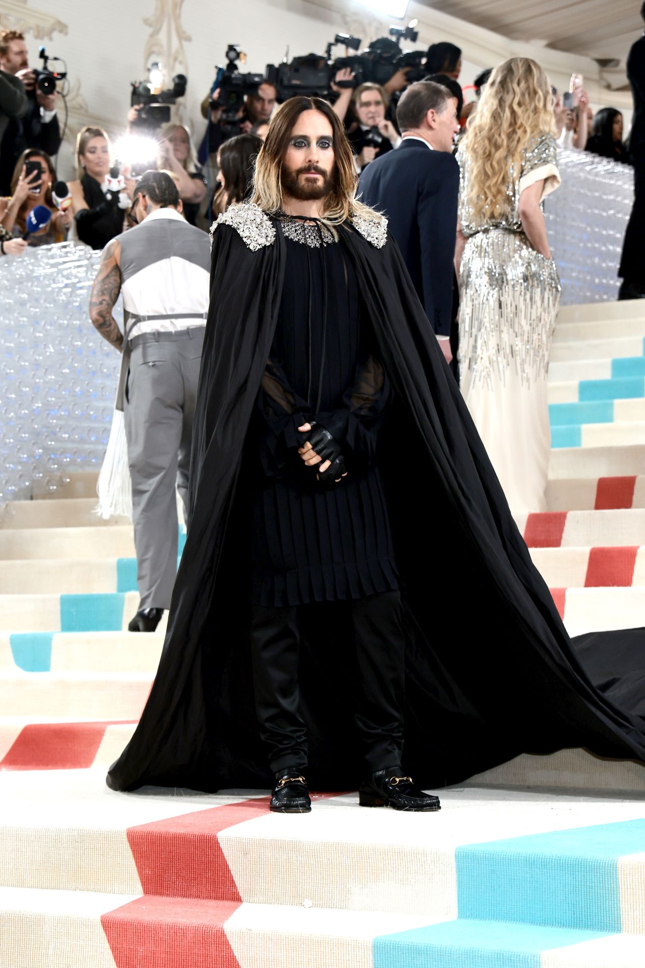 Leto shed the cat suit to expose an all-black look.