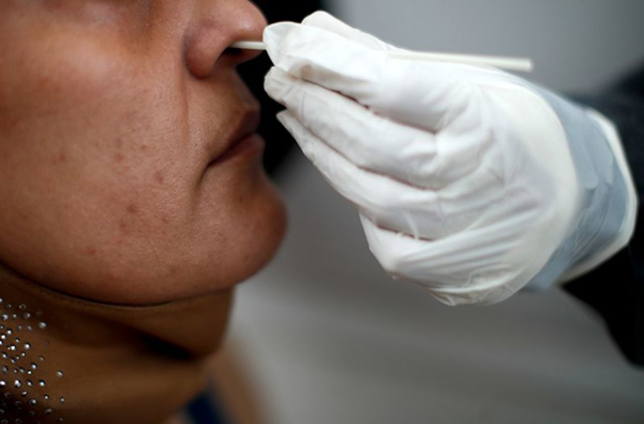 A healthcare worker conducts a nasal swab test for Covid-19 in Buenos Aires, Argentina, on October 19.