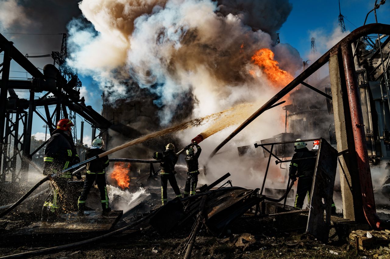 Firefighters work to put out a fire at a power station hit by a Russian missile on October 10 in Kyiv, Ukraine.