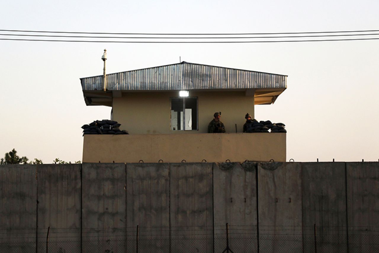 U.S soldiers stand guard at the airport tower near an evacuation control checkpoint during ongoing evacuations at Hamid Karzai International Airport, in Kabul, Afghanistan, Wednesday, August 25.