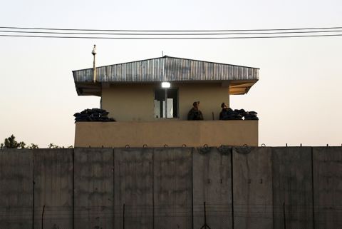 U.S soldiers stand guard at the airport tower near an evacuation control checkpoint during ongoing evacuations at Hamid Karzai International Airport, in Kabul, Afghanistan, Wednesday, August 25.