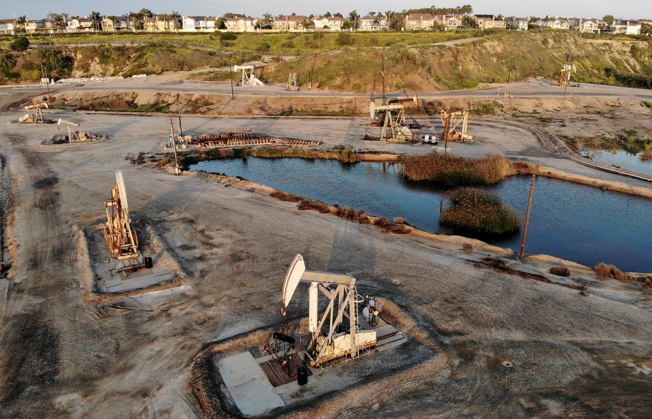 An aerial view shows oil pumpjacks at the Huntington Beach Oil Fields amid the coronavirus pandemic in Huntington Beach, California on April 20. 