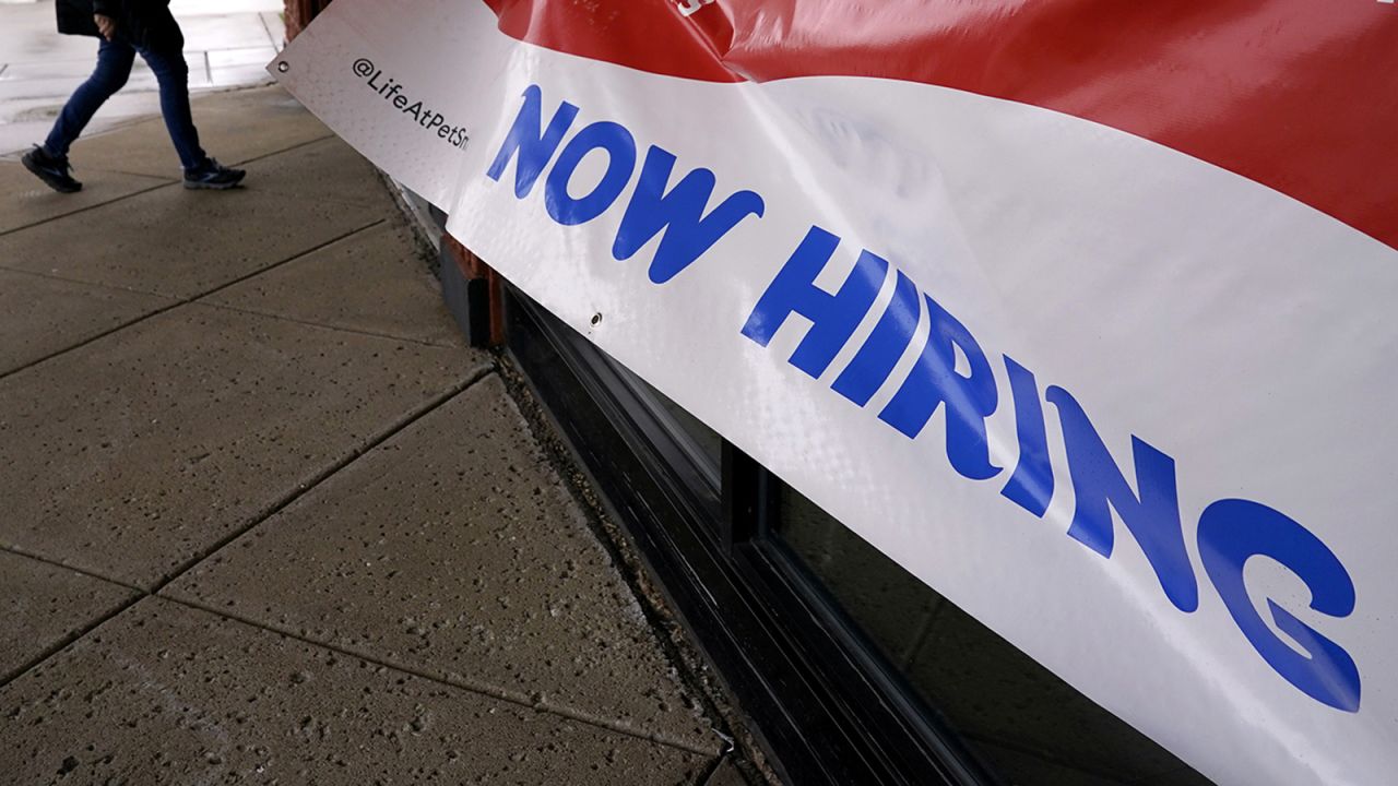 A hiring sign is displayed at a retail store in Downers Grove, Ill., on May 1.