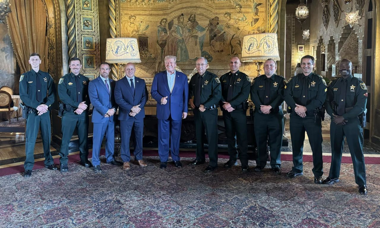 This photo from the Martin County Sheriff's Department shows former President Donald Trump with the Martin County Sheriff's deputies who apprehended Ryan Wesley Routh.