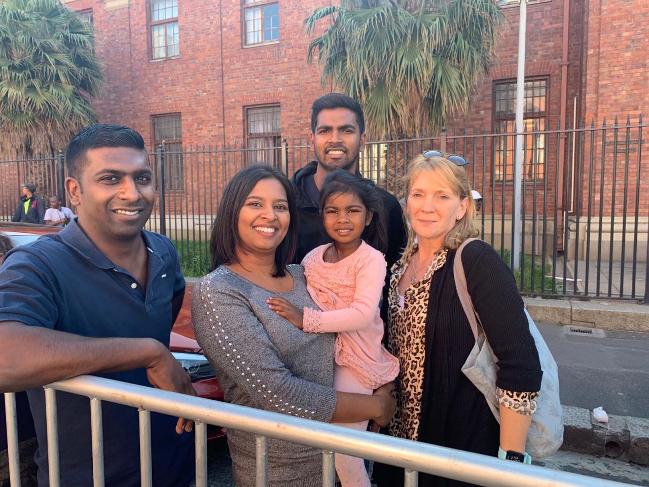 Sue Freeling, pictured far right, stands with the Roxanne Naidoo, her daughter Michaela Grace, husband Mark and family member Nigel Govindamsami. 