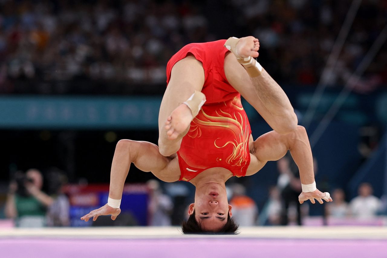 Zhang Boheng of China falls during his floor exercise on Wednesday.