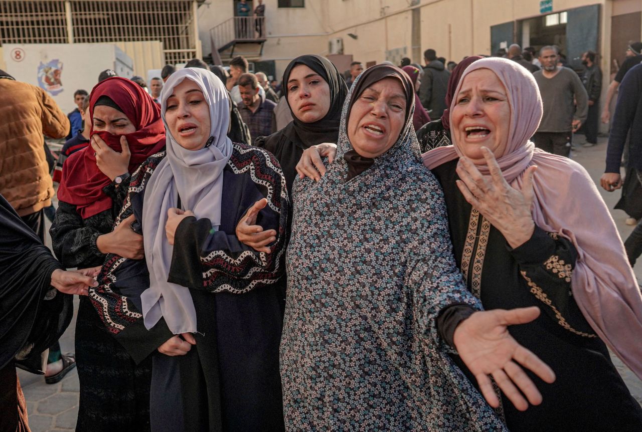 Palestinian women mourn the death of loved ones following Israeli bombardment in Al-Maghazi, central Gaza, on April 16.