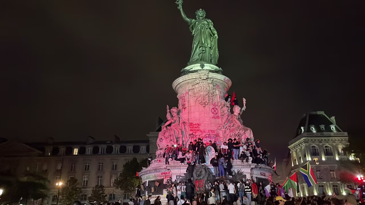 Crowds gather at Place de la République in Paris.