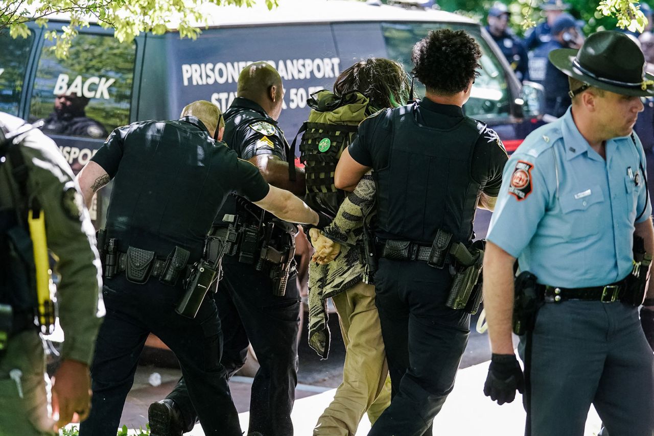 Police officers detain a demonstrator during a pro-Palestinian protest against the war in Gaza at Emory University on April 25, in Atlanta, Georgia. 