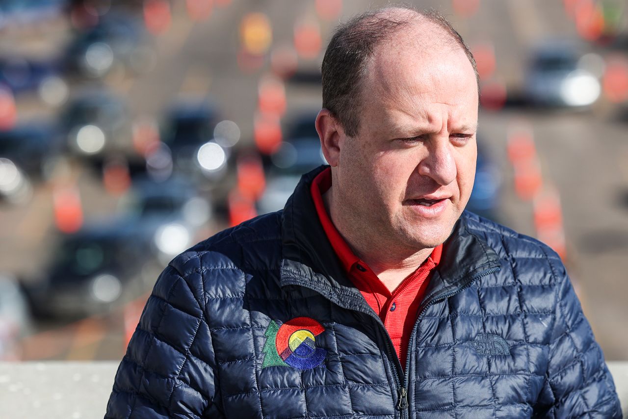 Colorado Governor Jared Polis speaks to the media at a mass COVID-19 vaccination event in Denver, on January 30.