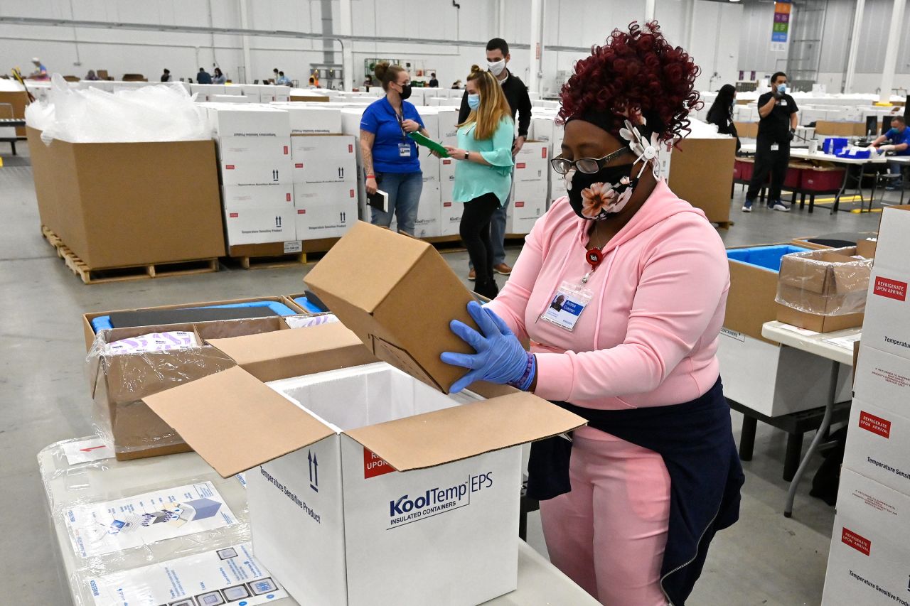 An employee with the McKesson Corporation packs a box of Johnson & Johnson Covid-19 vaccines for shipping in Shepherdsville, Kentucky, on March 1. 