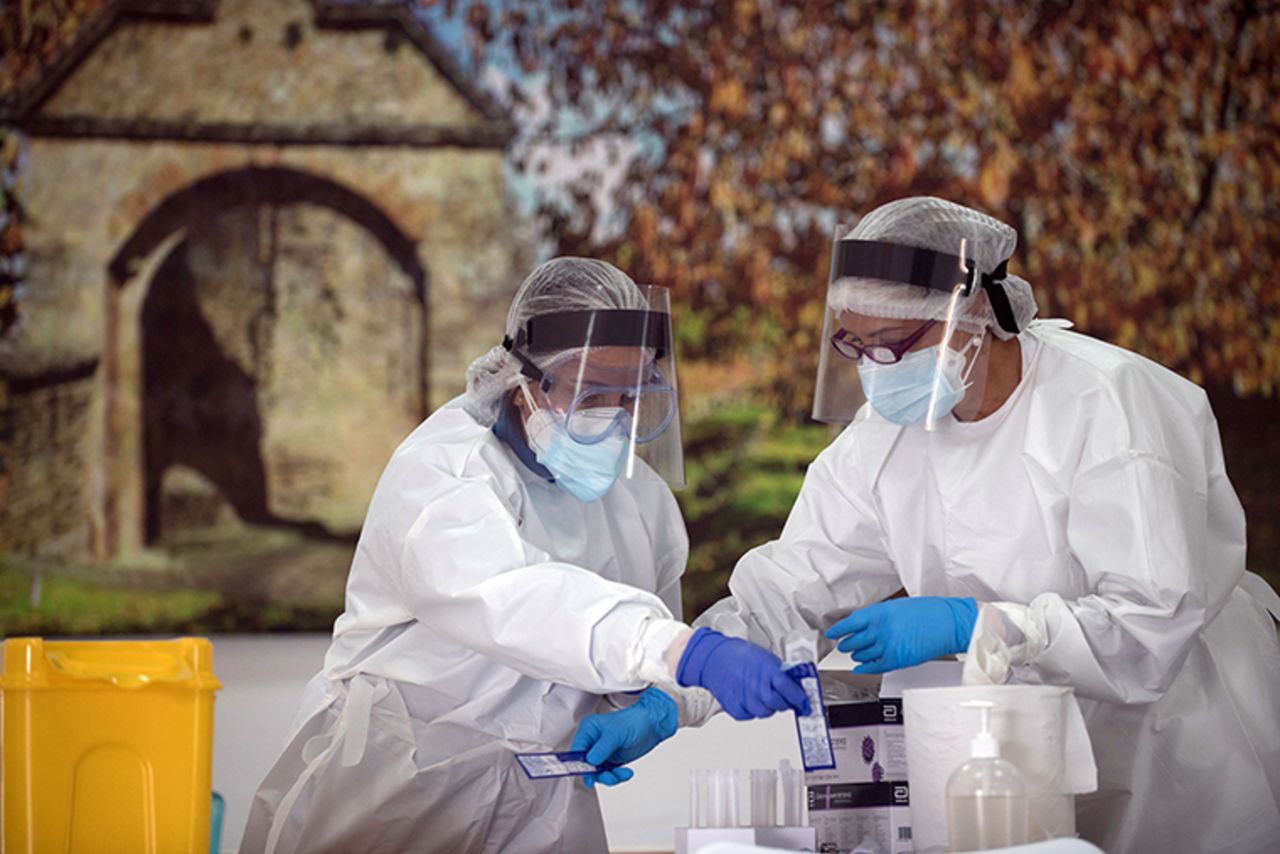 Healthcare workers handle swabs during a mass testing for COVID-19 at a temporary testing centre in Ronda, Spain on November 11. 