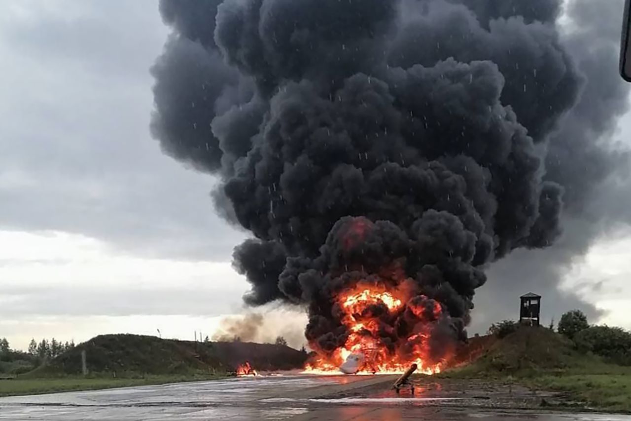 In this image released on social media on August 20, a Russian plane is pictured burning at the Soltsy air base in the Novgorod region in northwestern Russia.