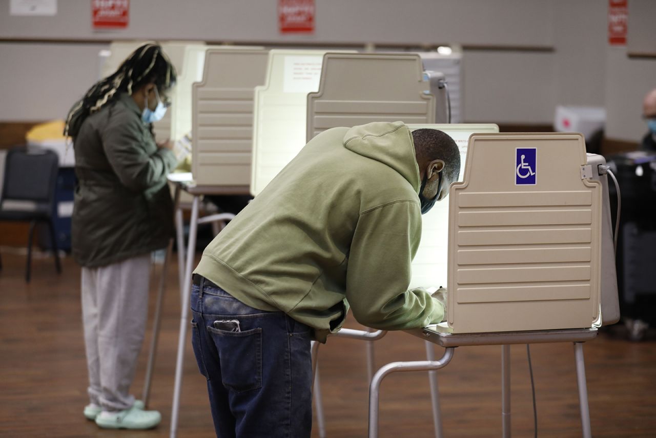 People vote in the 2020 general election at the Northwest Activities Center on November 3, in Detroit.