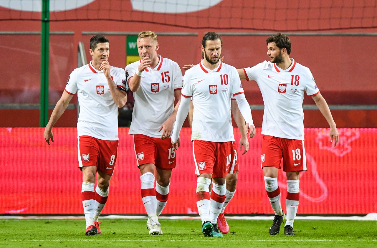 Robert Lewandowski (L) and his Poland team mates pictured during the FIFA World Cup 2022 Qatar qualifying match between Poland and Andorra on March 28, 2021 in Warsaw, Poland. 