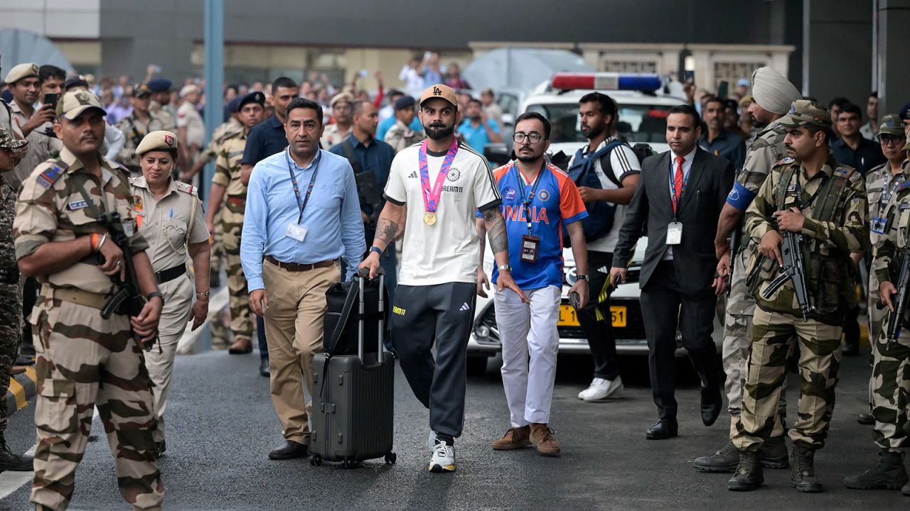 India's Virat Kohli, center, arrives at the Indira Gandhi International Airport in New Delhi, India, on July 4.