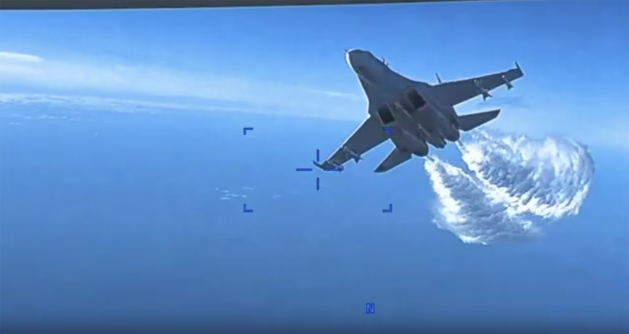 US Air Force MQ-9 camera footage showing a Russian Su-27 flying along side.