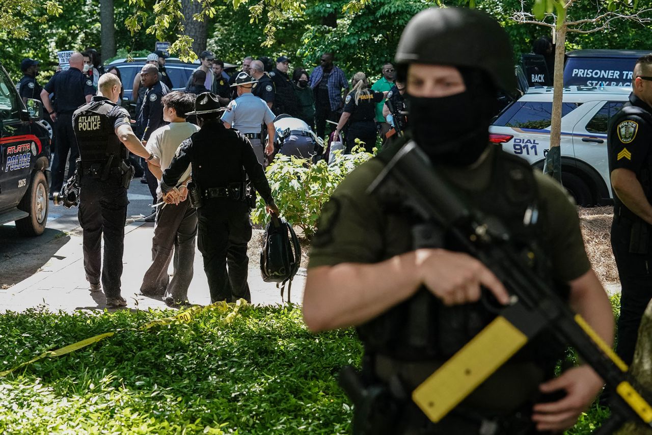 Police officers detain a protester as a pro-Palestinian demonstration takes place at Emory University on April 25, in Atlanta, Georgia. 