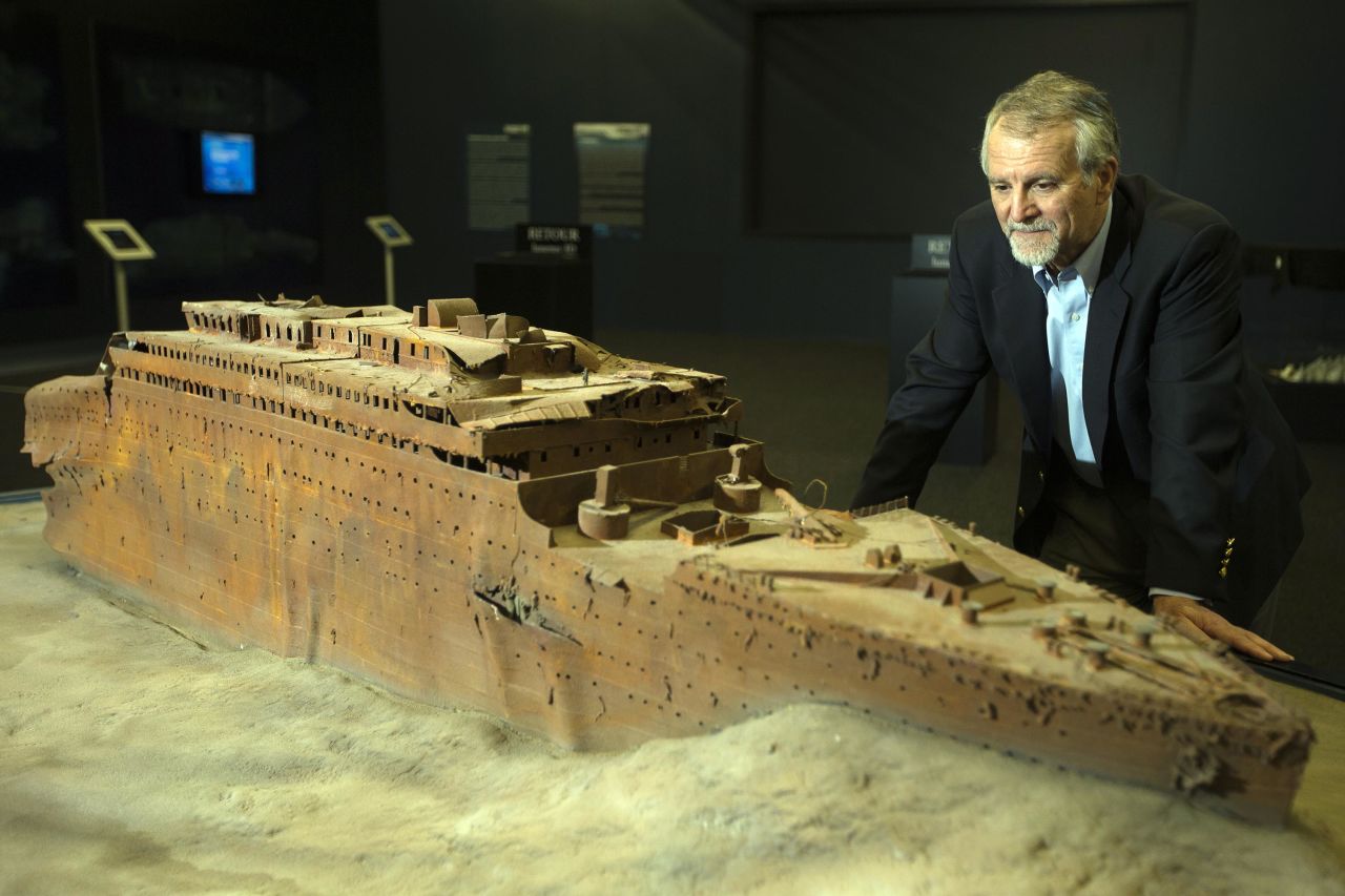 Paul-Henri Nargeolet is pictured next to a miniature version of the sunken Titanic at an exhibition in Paris in 2013.