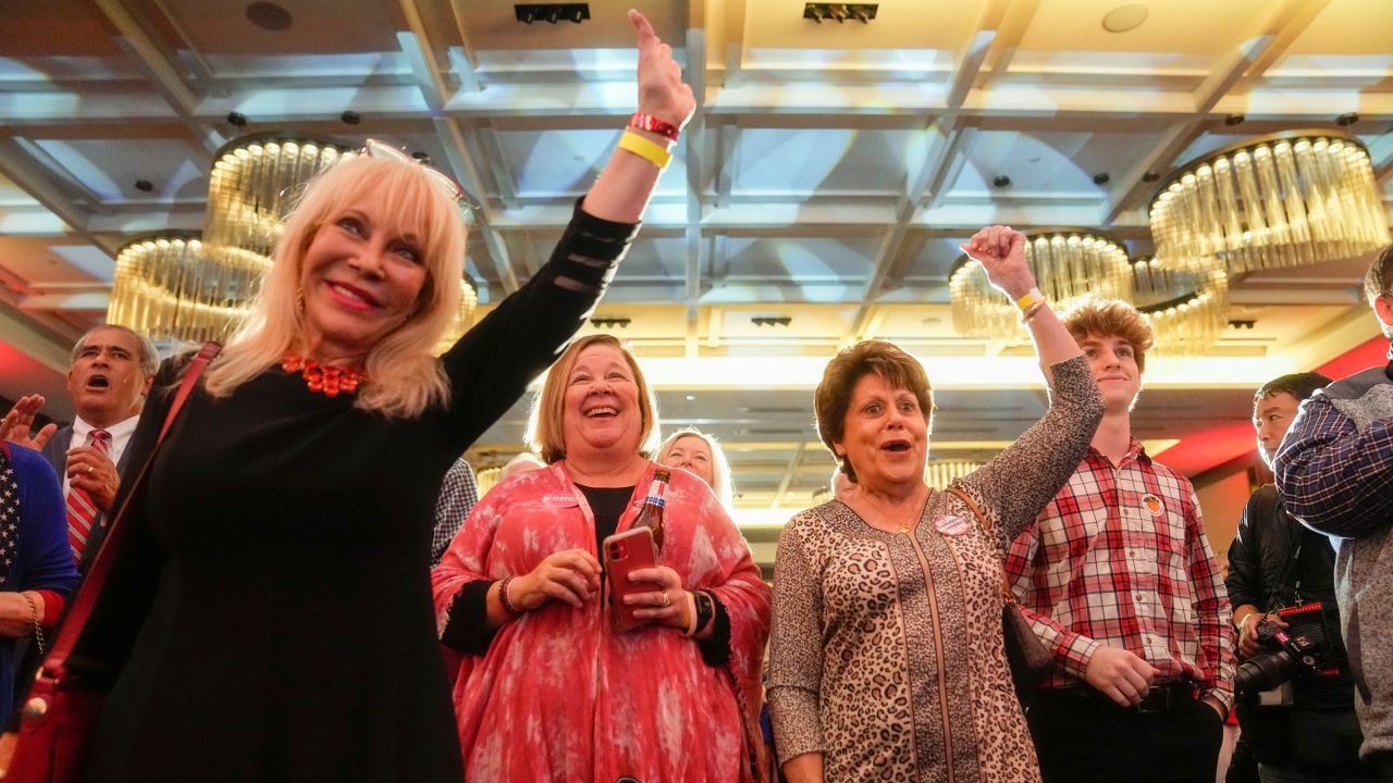 People cheer at a Herschel Walker watch party in Smyrna, Georgia. Walker, a Republican, is running for governor.