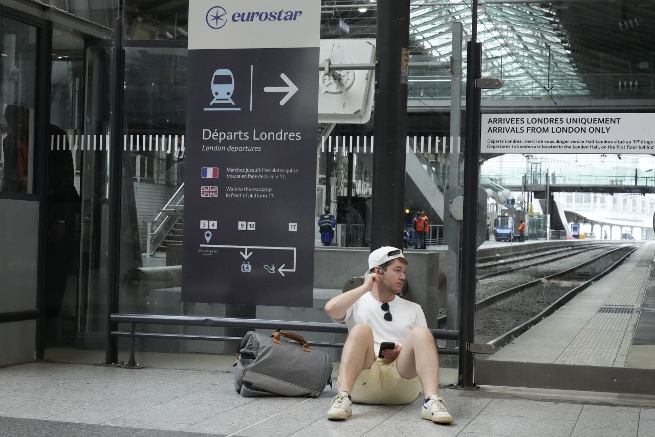 A traveler waits by platforms for the Eurostar high speed train at Gare du Nord station in Paris, on July 26. 