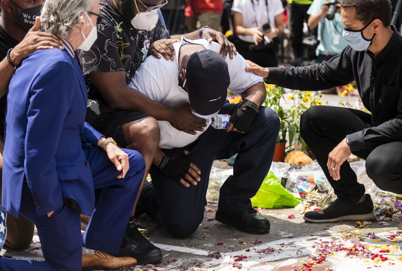 George Floyd's brother, Terrence Floyd, visits a makeshift memorial in Minneapolis on June 1.