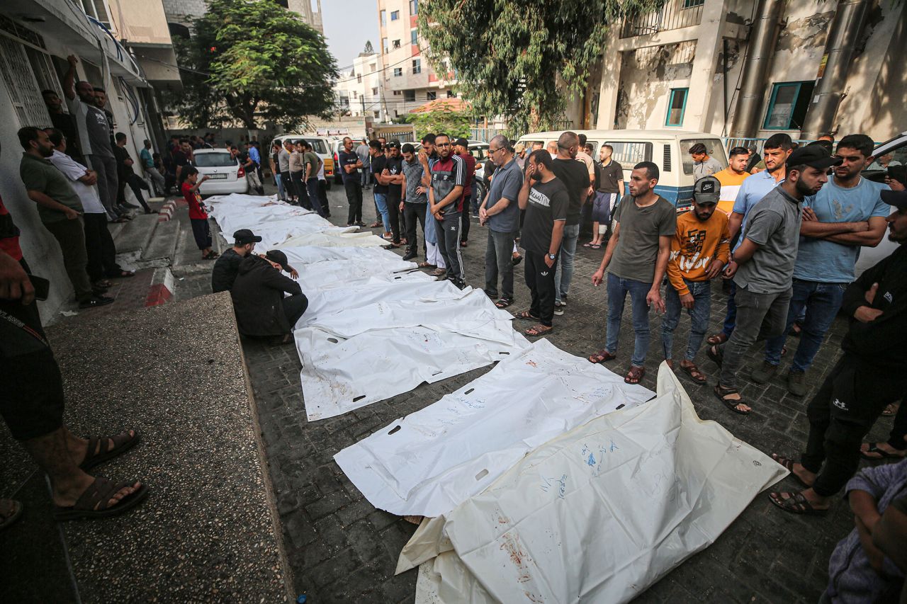 Bodies of Palestinians killed in Israeli airstrikes lie outside the Shifa Hospital, waiting to be buried after funeral prayers in Gaza City, Gaza, on October 11.