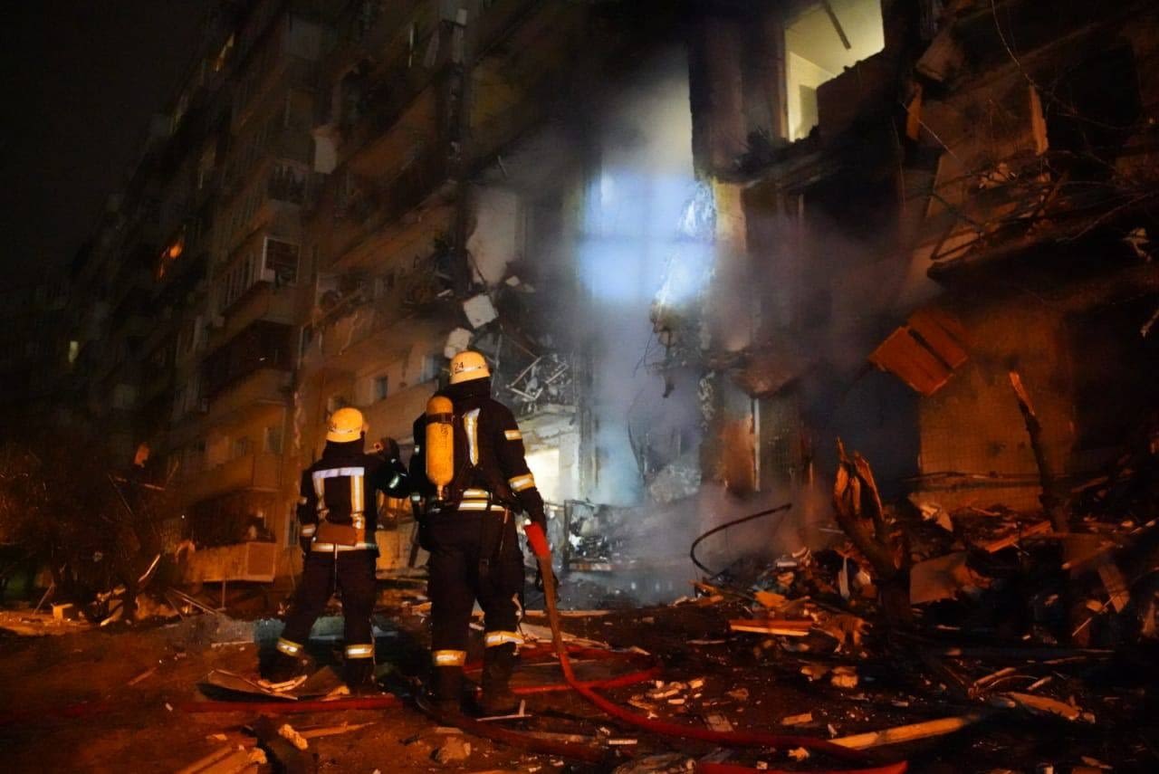 Firefighters outside a residential building in Kyiv, Ukraine, on Friday.