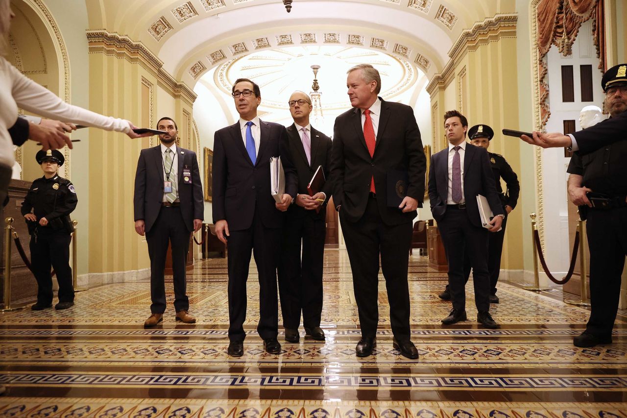 Treasury Secretary Steven Mnuchin speaks to reporters after arriving at the U.S. Capitol to continue negotiations on a $2 trillion economic stimulus in response to the coronavirus pandemic, on March 24.