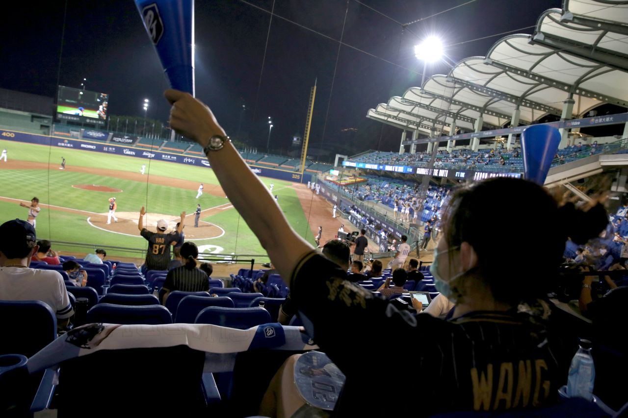 Fans cheer during the game between Fubon Guardians and Uni-President Lions at Xinzhuang Baseball Stadium in New Taipei City on May 8.