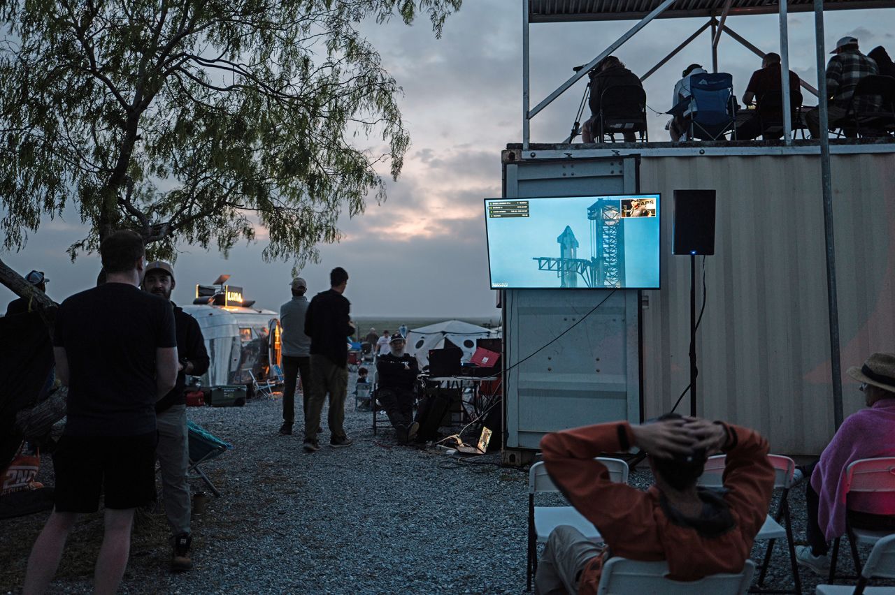 People wait together at Rocket Ranch for the launch of the SpaceX Starship in Brownsville, Texas, on March 14.