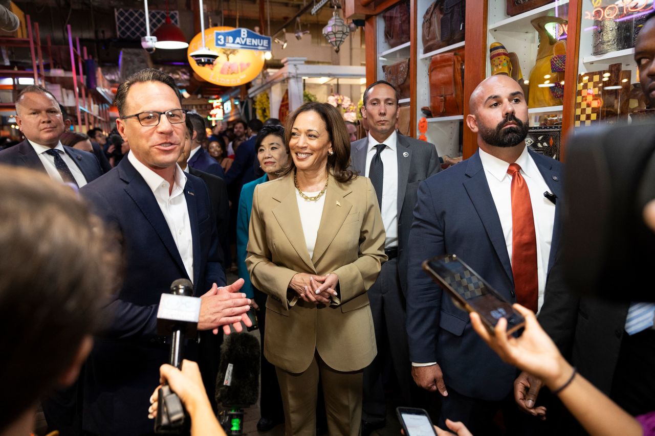 Pennsylvania Gov. Josh Shapiro, left, and Vice President Kamala Harris speak to the pressin Philadelphia on July 13.