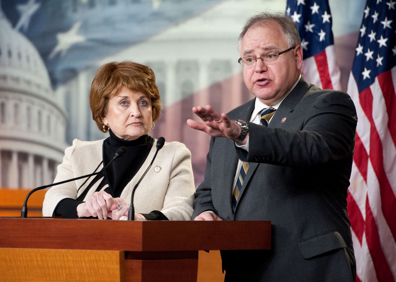 Then-Rep. Tim Walz speaks alongside Rep. Louise Slaughter during a news conference in 2012.