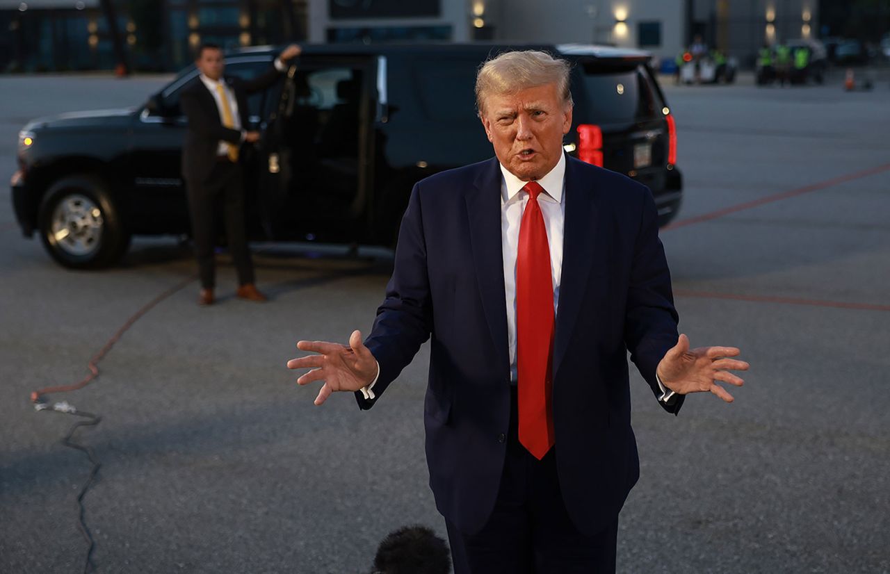 Trump speaks to the media at Atlanta Hartsfield-Jackson International Airport.