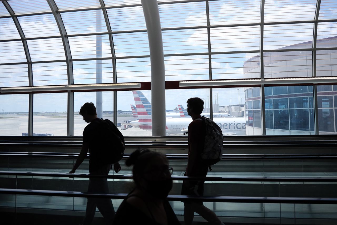 Passengers walk between terminals at Charlotte Douglas International Airport on May 15 in Charlotte, North Carolina.