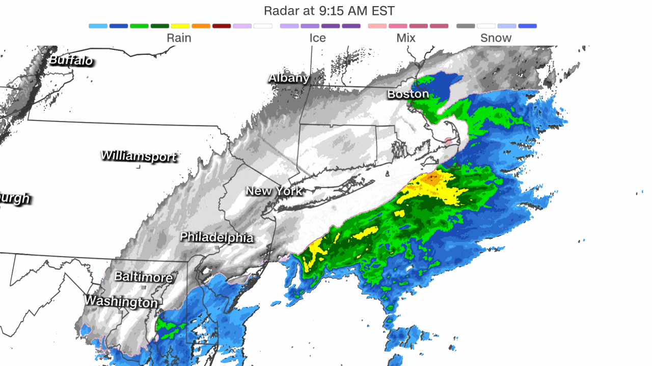 This radar snapshot shows snow falling across a large portion of the Northeast, while mainly rain falls just off the coast. 