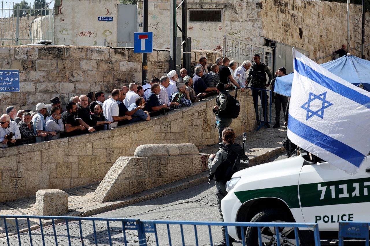 Israeli border police watch as Muslim worshippers arrive at the Lion's Gate to make their way to the al-Aqsa Mosque compound for the Friday noon prayer in East Jerusalem on November 3.