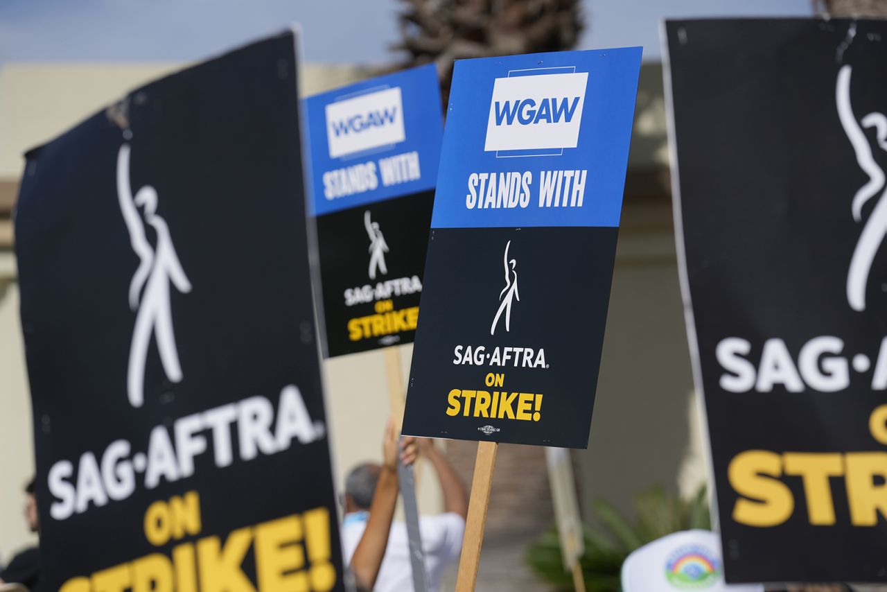 Picketers demonstrate outside Paramount Pictures studio on September 27 in Los Angeles.