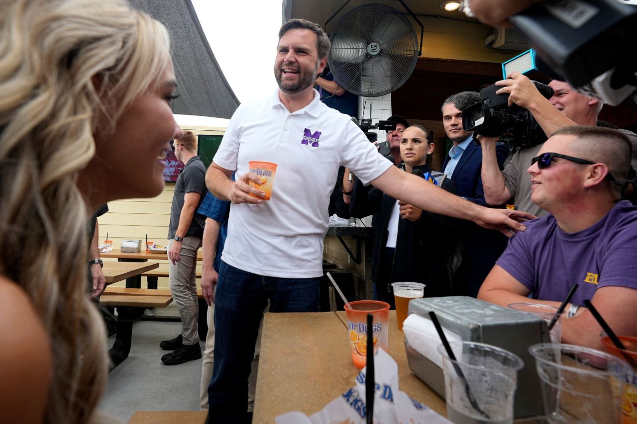 Republican vice presidential nominee JD Vance speaks with patrons at Sup Dog in Greenville, North Carolina, on Saturday. 