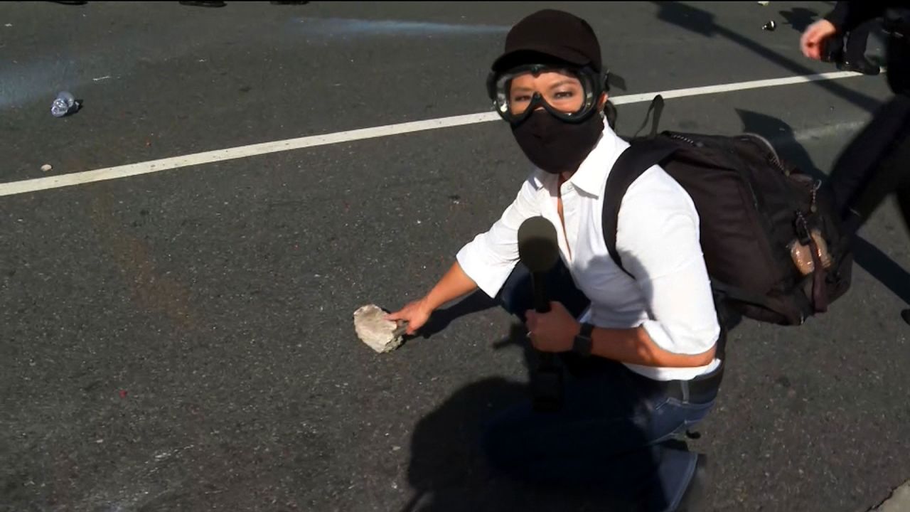 CNN's Kyung Lah points to a piece of concrete being thrown at police in Santa Monica on May 31.