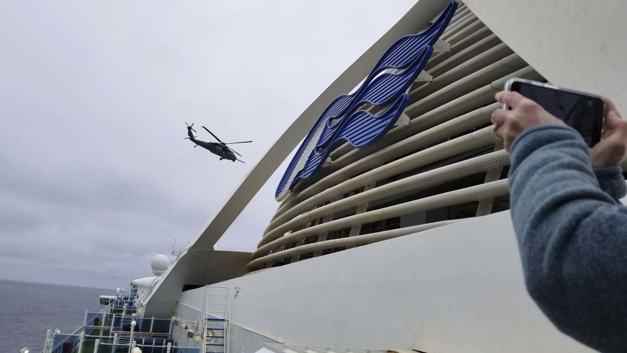 A National Guard helicopter delivering coronavirus testing kits hovers above the Grand Princess cruise ship off the California coast on Thursday.