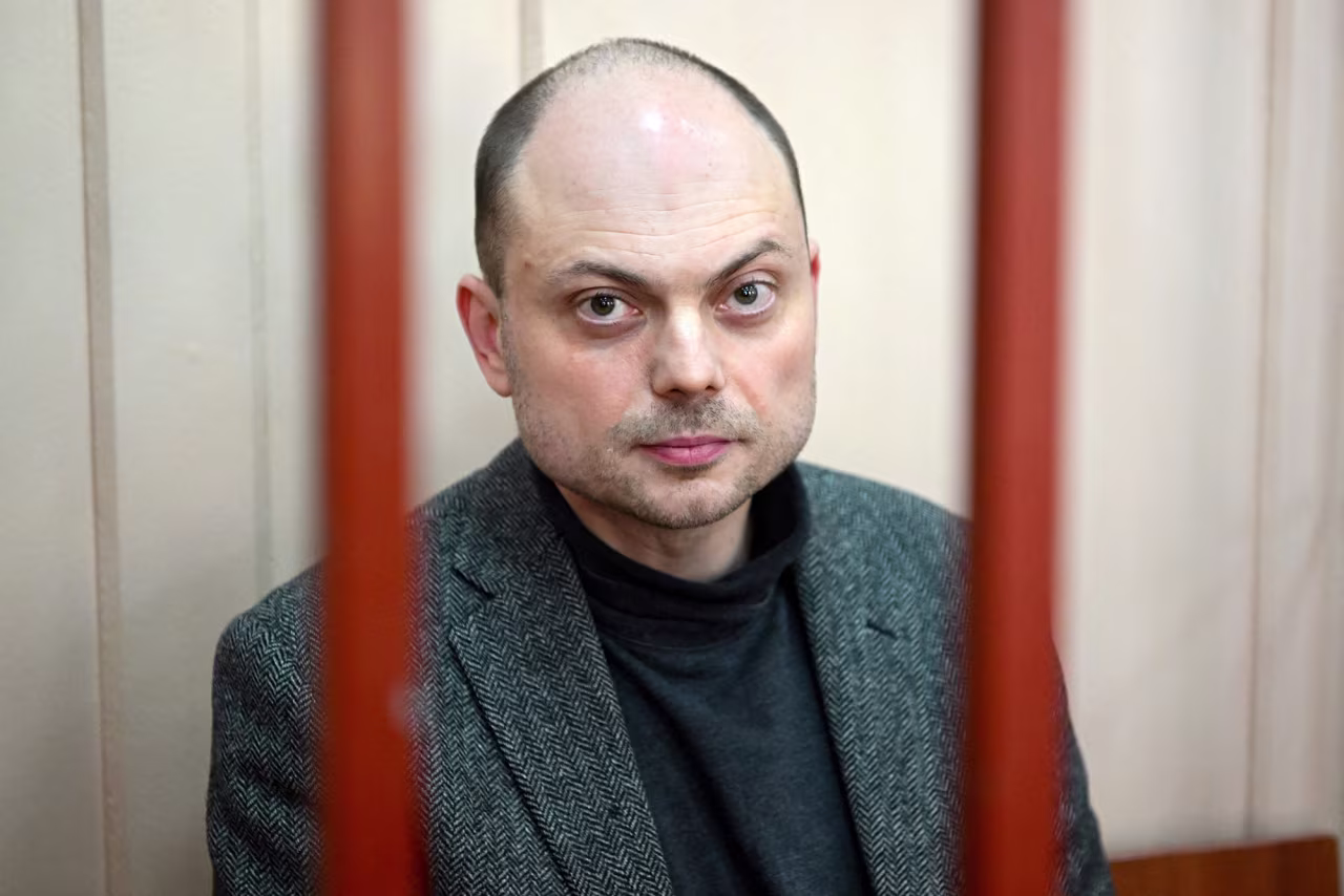 Russian opposition activist Vladimir Kara-Murza sits on a bench inside a defendants' cage during a hearing at the Basmanny court in Moscow, Russia, on October 10, 2022.
