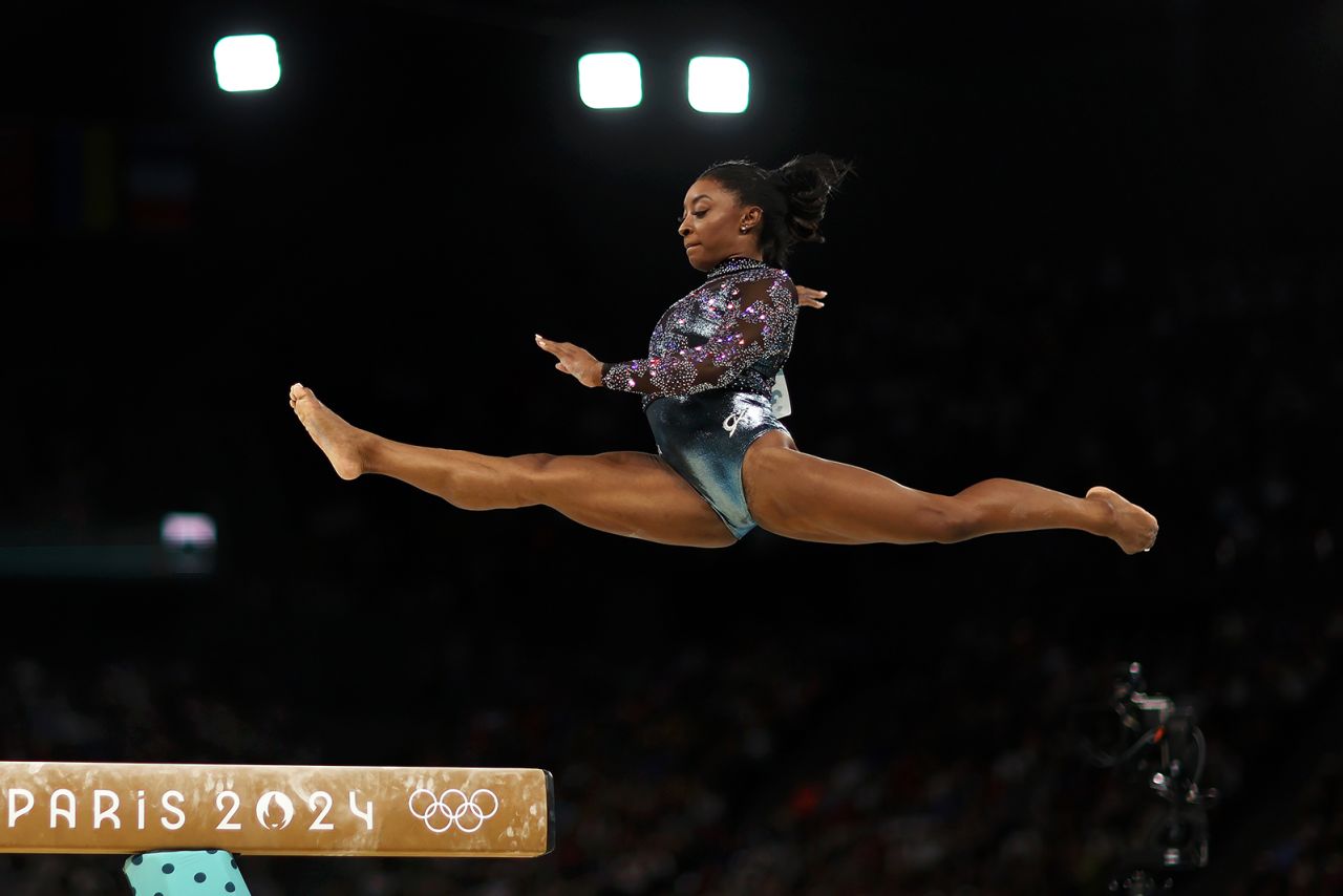 Simone Biles of Team USA competes on the beam during the Women's Artistic Gymnastics Qualification on day two of the Olympic Games Paris 2024 at Bercy Arena on July 28, in Paris, France. 