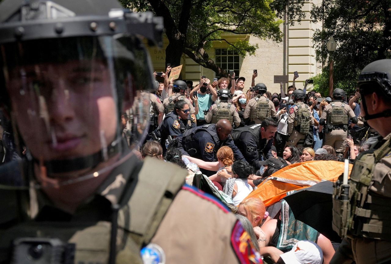 Pro-Palestinian protesters are confronted by police at the University of Texas in Austin on Monday. 