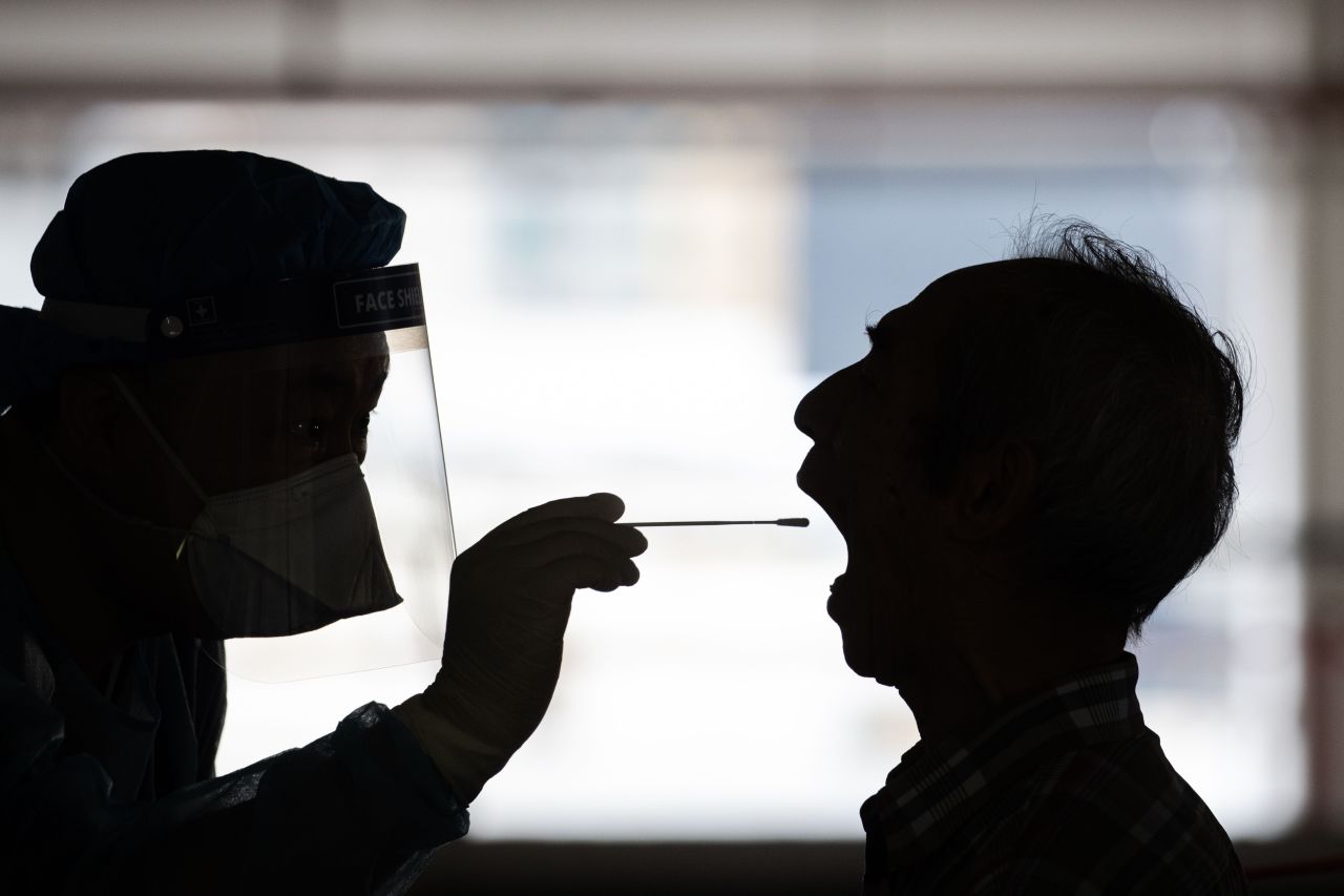 A person undergoes a swab test on July 23 at a makeshift Covid-19 testing lab in Hong Kong.