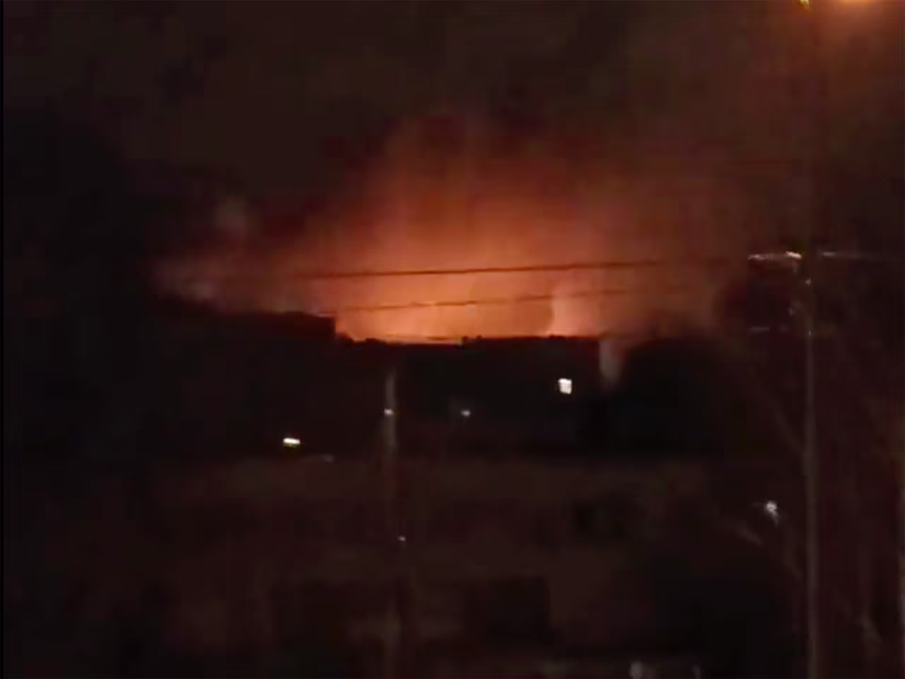 A frame taken from a video shared on Twitter shows explosions purportedly taken near the Kyiv Zoo.